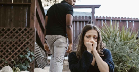 A man walking away from his wife