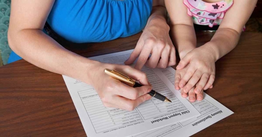 A mother and daughter working on a "child support worksheet"