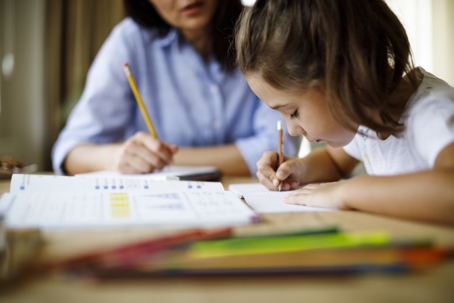 parent helping child with homework