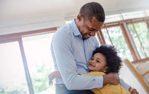 child hugging father