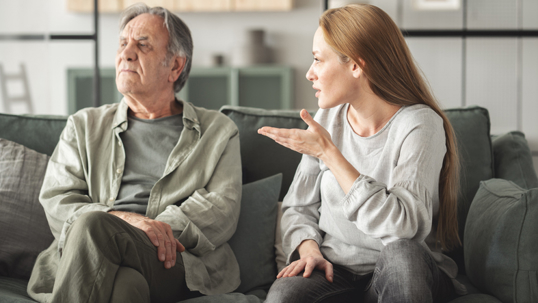elderly father and adult daughter in a fight